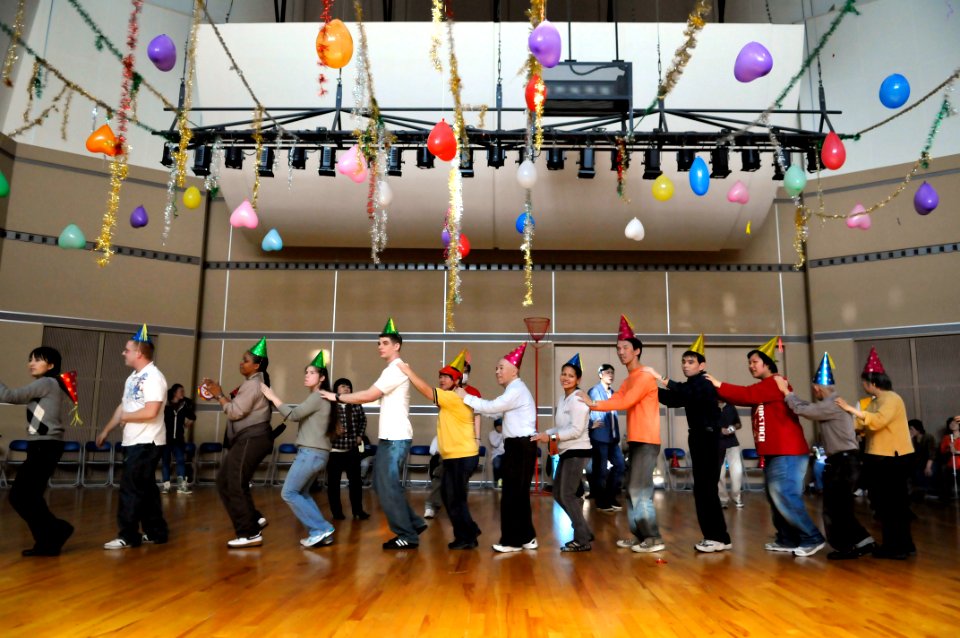US Navy 101203-N-9818V-125 Sailors from Commander Fleet Activities, Yokosuka, dance with disabled citizens at the Sogo Fukushi Center during a Chri