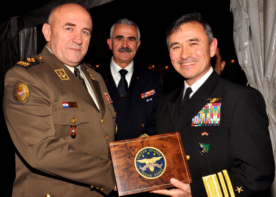 US Navy 101203-N-5483N-049 Vice Adm. Harry B. Harris Jr., right, resents Croatia chief of defense Gen. Josip Lucic with a U.S. 6th Fleet gift box d