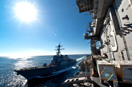 US Navy 101205-N-1783P-024 The guided-missile destroyer USS John McCain (DDG 56) pulls alongside the aircraft carrier USS George Washington (CVN 73