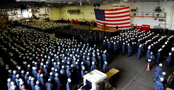US Navy 101203-N-2475A-015 Sailors stand at attention in the hangar bay during a frocking ceremony aboard USS John C. Stennis (CVN 74)