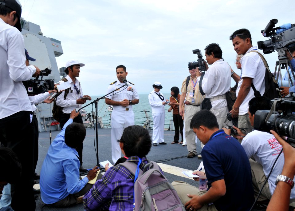 US Navy 101203-N-8721D-042 Cmdr. Michael V. Misiewicz, commanding officer of the guided-missile destroyer USS Mustin (DDG 89), addresses media duri