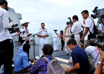 US Navy 101203-N-8721D-042 Cmdr. Michael V. Misiewicz, commanding officer of the guided-missile destroyer USS Mustin (DDG 89), addresses media duri