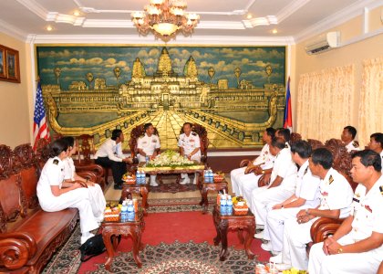 US Navy 101203-N-8721D-122 Cmdr. Michael V. Misiewicz, commanding officer of the guided-missile destroyer USS Mustin (DDG 89), visits with Cambodia