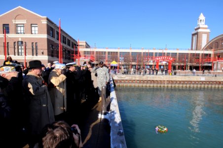 US Navy 101207-N-8848T-939 Pearl Harbor survivors and attendees salute a wreath at the annual Pearl Harbor remembrance ceremony on Chicago's Navy P