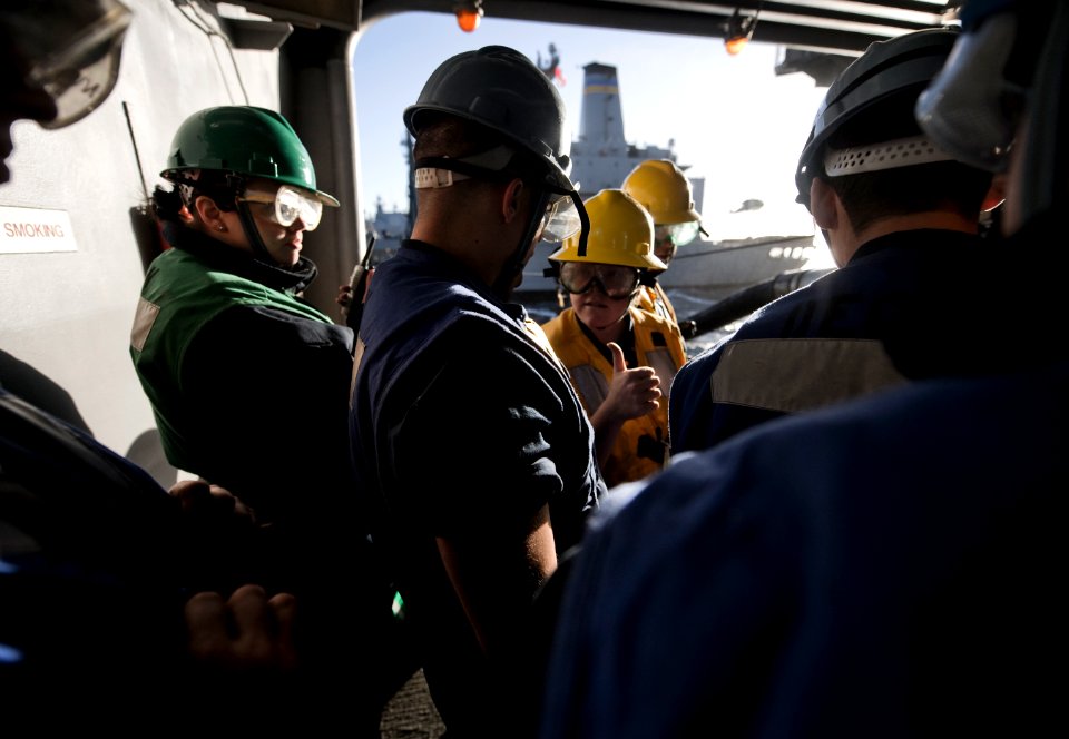 US Navy 101208-N-2055M-380 Boatswain's Mate 3rd Class Hillary Luke gives a thumbs up indicating things are safe aboard the aircraft carrier USS Car