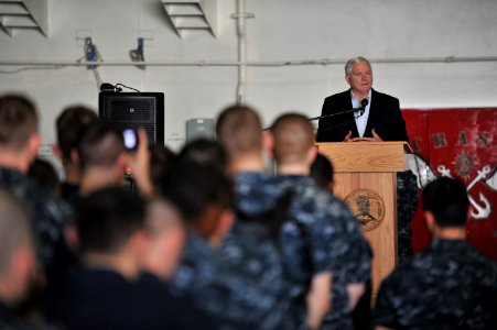 US Navy 101206-N-5016P-006 Secretary of Defense Robert M. Gates delivers remarks during an all-hands call aboard the aircraft carrier USS Abraham L