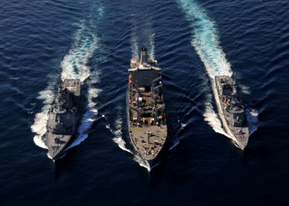 US Navy 101205-N-2013O-067 The Military Sealift Command fleet replenishment oiler USNS Tippecanoe (T-AO 199) refuels the Japan Maritime Self-Defens