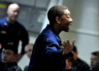 US Navy 101205-N-2055M-368 Command Master Chief April Beldo addresses Sailors during a second class petty officer leadership course aboard the airc