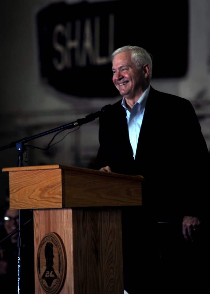 US Navy 101206-N-4973M-150 Secretary of Defense Robert M. Gates delivers remarks during an all-hands call aboard the aircraft carrier USS Abraham L
