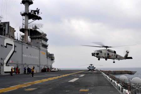 US Navy 101207-N-9950J-143 A Japan Maritime Self-Defense Force SH-60K Sea Hawk helicopter lands aboard the forward-deployed amphibious assault ship