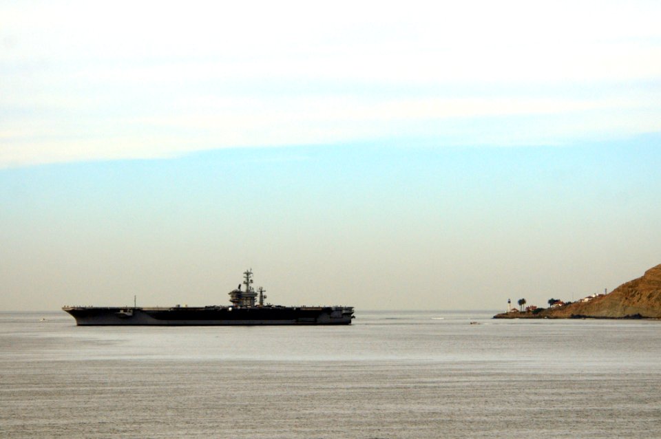 US Navy 101206-N-3659B-147 USS Nimitz (CVN 68) cruises past the historic Point Loma Light House in San Diego