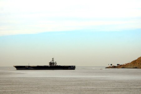 US Navy 101206-N-3659B-147 USS Nimitz (CVN 68) cruises past the historic Point Loma Light House in San Diego