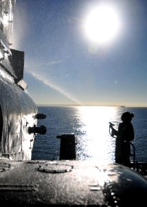 US Navy 101208-N-1722W-047 Sgt. Jessica Tracey washes a CH-46E Sea Knight during regularly scheduled maintenance aboard USS Boxer (LHD 4)