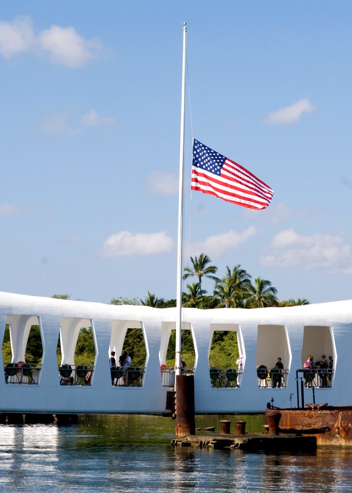 US Navy 101207-N-5476H-300 The national ensign flies at half-mast during a ceremony commemorating the 69th anniversary of the Dec. 7, 1941 Japanese