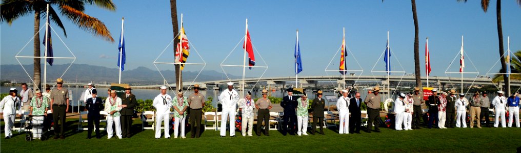 US Navy 101207-N-3666S-155 Attendees pay respects during a ceremony commemorating the 69th anniversary of the attack on Pearl Harbor photo