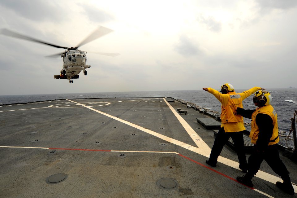 US Navy 101207-N-8335D-456 Boatswain's Mate Seaman Josh Hiner holds Boatswain's Mate 3rd Class Jennifer Boulin