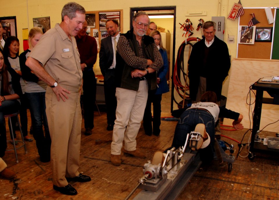 US Navy 101210-N-3241S-034 A crewmember of the Old Saybrook High School submarine team demonstrates to Rear Adm. Michael McLaughlin how their subme