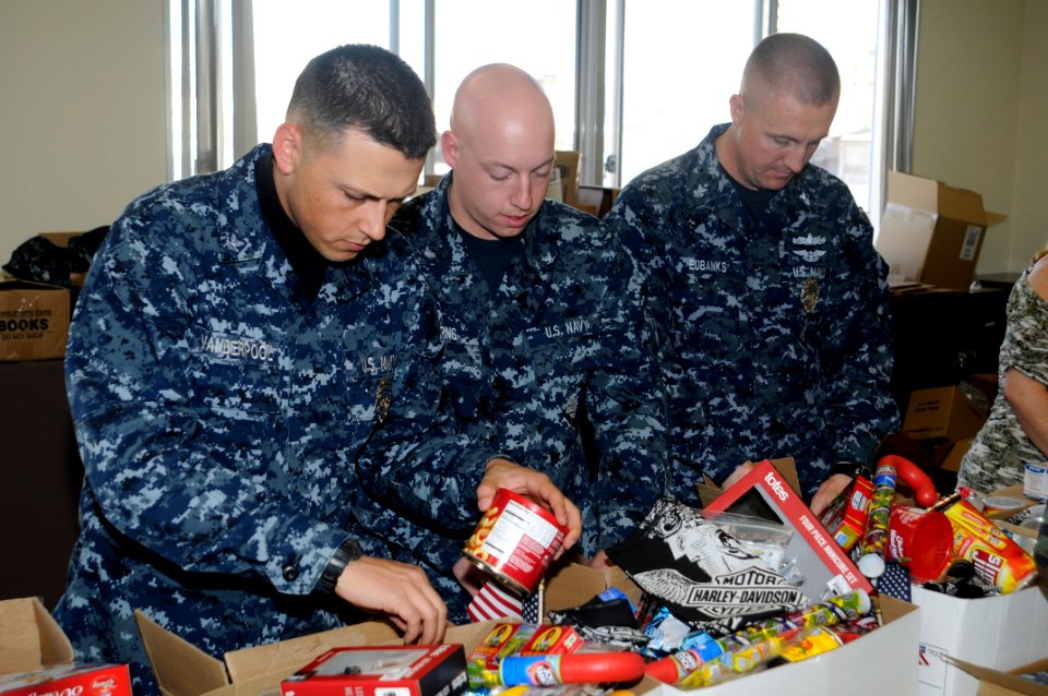 US Navy 101209-N-4920H-023 Master-at-Arms 2nd Class Ryan Vanderpool, left, Master-at-Arms 3rd Class Jason Burns, and Master-at-Arms 1st Class Van E