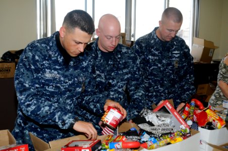 US Navy 101209-N-4920H-023 Master-at-Arms 2nd Class Ryan Vanderpool, left, Master-at-Arms 3rd Class Jason Burns, and Master-at-Arms 1st Class Van E photo