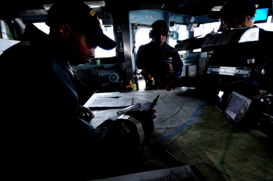 US Navy 101210-N-3659B-026 Quartermaster Valissa Durrell charts a course while serving as the quartermaster of the watch aboard USS Comstock (LSD 4