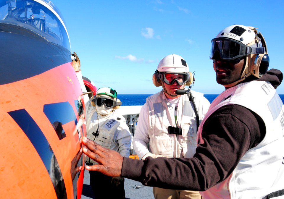 US Navy 101211-N-8913A-133 Safety Officer Patrick C. Honeck, center, gives Shawn Springs a tour of a T-45 Goshawk