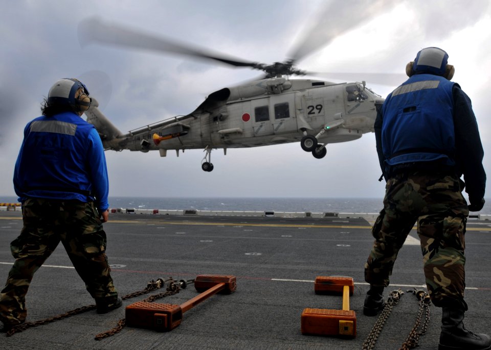 US Navy 101207-N-9950J-328 Aviation Boatswain's Mate (Handling) Airman Skye Kelley, left, and Aviation Boatswain's Mate (Handling) Airman Apprentic