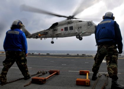US Navy 101207-N-9950J-328 Aviation Boatswain's Mate (Handling) Airman Skye Kelley, left, and Aviation Boatswain's Mate (Handling) Airman Apprentic