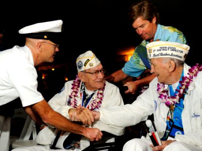 US Navy 101207-N-7498L-015 Art Herriford, left, president of the Pearl Harbor Survivors Association, greets fellow veteran DeWayne Chartier during photo