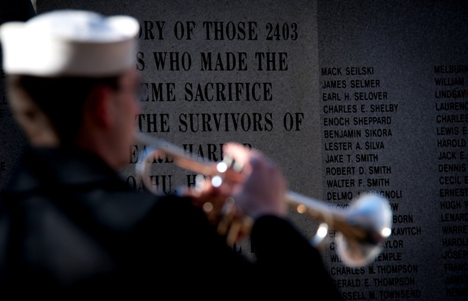 US Navy 101207-N-7874H-137 A Sailor assigned to the U.S. Fleet Forces Command Ceremonial Band plays taps during the Pearl Harbor Remembrance Ceremo