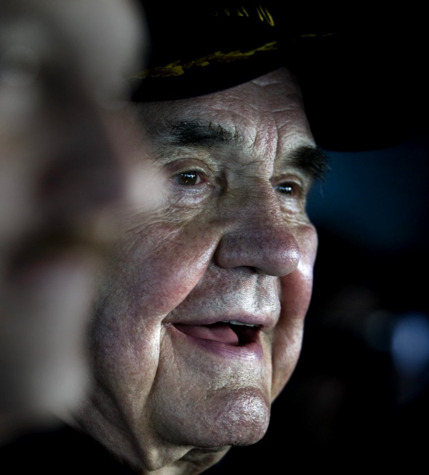 US Navy 101212-N-2055M-059 Legendary sports broadcaster Dick Enberg observes flight operations aboard USS Carl Vinson (CVN 70) (cropped)