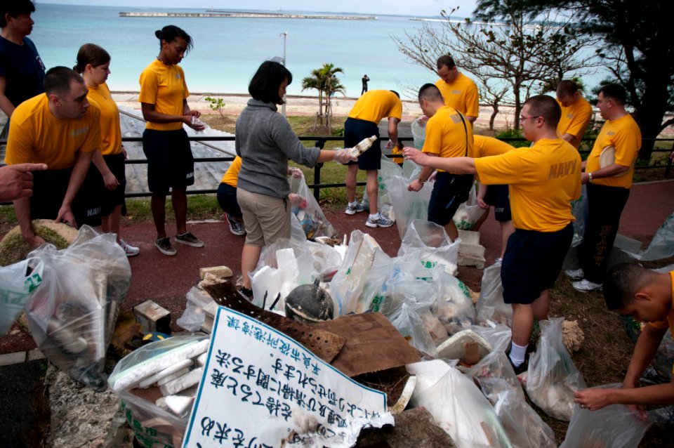 US Navy 101212-N-5758H-006 Members of the U.S. 7th Fleet Band, Far East Edition, separate trash they collected from Painagama Beach