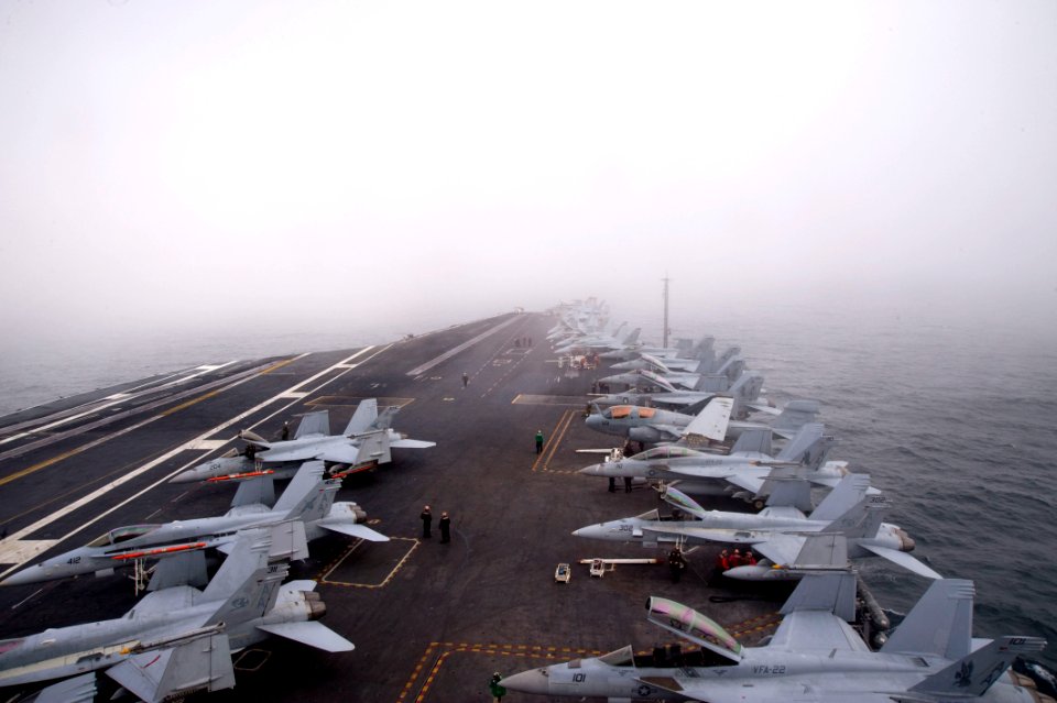 US Navy 101209-N-2953W-188 Sailors prepare for a launch evolution in foggy conditions aboard the aircraft carrier USS Carl Vinson (CVN 70)