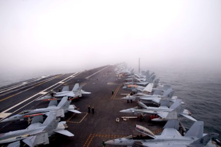 US Navy 101209-N-2953W-188 Sailors prepare for a launch evolution in foggy conditions aboard the aircraft carrier USS Carl Vinson (CVN 70)