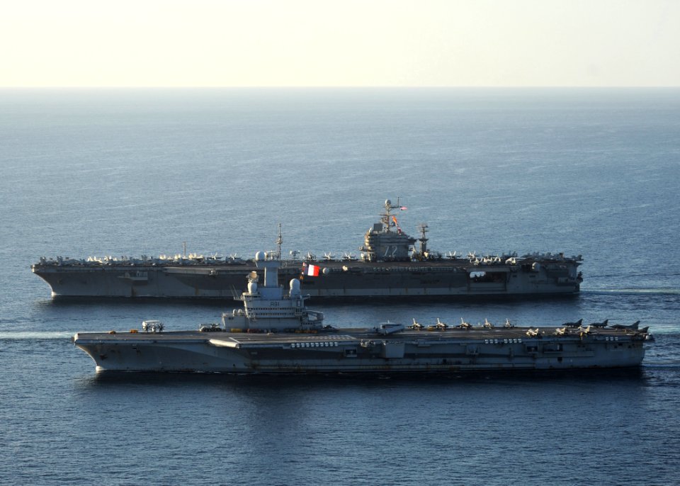US Navy 101210-N-1261P-028 The aircraft carrier USS Abraham Lincoln (CVN 72), back, and the French navy aircraft carrier Charles De Gaulle (R 91) a
