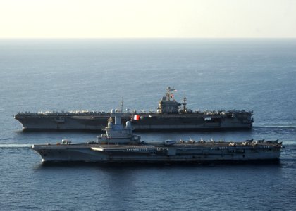 US Navy 101210-N-1261P-028 The aircraft carrier USS Abraham Lincoln (CVN 72), back, and the French navy aircraft carrier Charles De Gaulle (R 91) a
