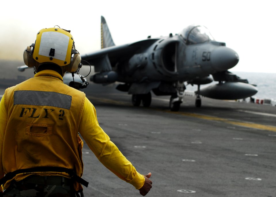 US Navy 101209-N-2218S-056 An AV-8B Harrier jet aircraft prepares to take off aboard the amphibious assault ship USS Essex (LHD 2) to take part in