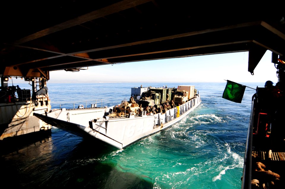 US Navy 101209-N-3659B-072 A landing craft utility carrying Sailors and Marines departs the well deck of USS Comstock (LSD 45)