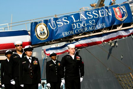 US Navy 101217-N-5758H-041 Side boys assigned to USS Lassen (DDG 82) stand at attention during a change of command ceremony