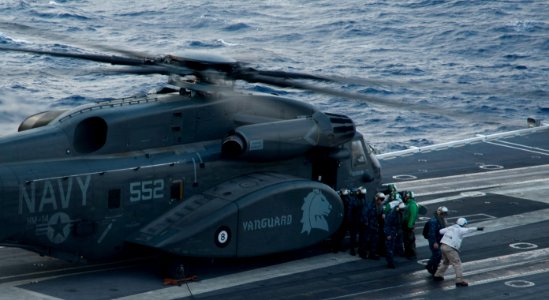 US Navy 101209-N-9626Y-113 A CH53-Sea Stallion helicopter offloads passengers onto USS George Washington (CVN 73)