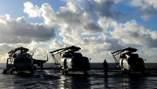 US Navy 101214-B-3793B-016 A Sailor takes a break from his work aboard the aircraft carrier USS Harry S. Truman (CVN 75)