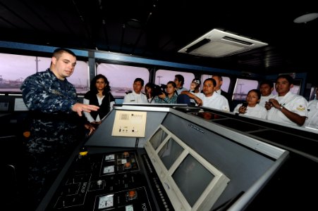 US Navy 101210-N-7589W-171 Lt. j.g. Steve Rockwell speaks to Peruvian sailors and journalism students during a tour of High Speed Vessel Swift (HSV photo