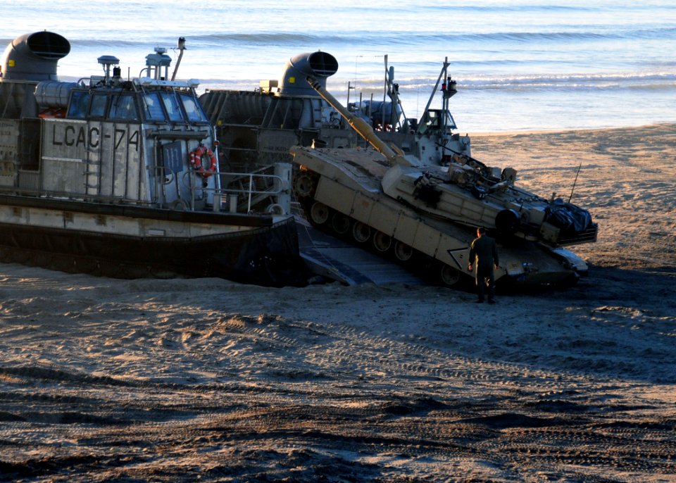 US Navy 101213-N-1722W-746 An M1A1 Abrams tank assigned to the 13th Marine Expeditionary Unit (13th MEU) departs a landing craft air cushion (LCAC)