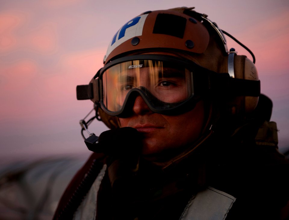 US Navy 101211-N-7981E-381 Aircrew Survival Equipmentman 1st Class Marcus Fields observes aircraft launch and recovery aboard USS Carl Vinson (CVN