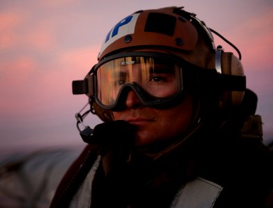 US Navy 101211-N-7981E-381 Aircrew Survival Equipmentman 1st Class Marcus Fields observes aircraft launch and recovery aboard USS Carl Vinson (CVN