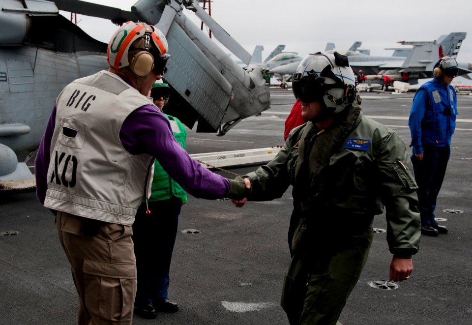 US Navy 101214-N-7981E-055 Vice Adm. Allen G. Myers meets Cmdr. Putnam H. Browne uring a visit to USS Carl Vinson (CVN 70)
