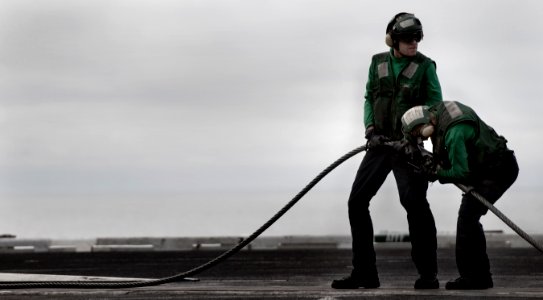 US Navy 101215-N-2055M-057 Aviation Boatswain's Mate (Equipment) Airman Taylor Johnson and Aviation Boatswain's Mate (Equipment) Airman William Wal