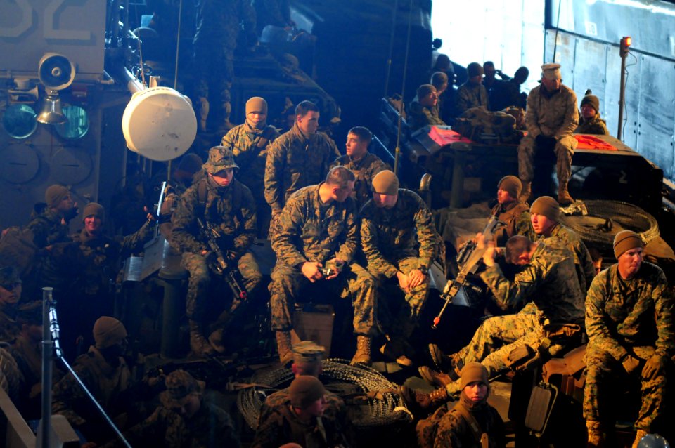 US Navy 101215-N-3659B-101 Marines rwait to disembark a landing craft utility in the well deck of USS Comstock (LSD 45)