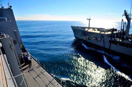 US Navy 101212-N-7042V-069 The Military Sealift Command fleet replenishment oiler USNS Henry J. Kaiser (T-AO 187) extends a fuel line to the amphib