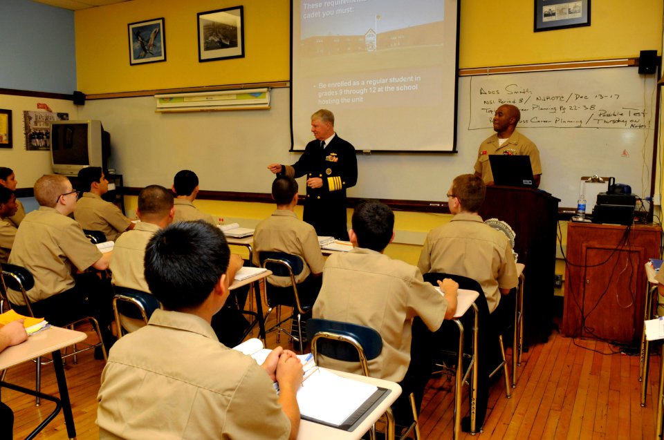 US Navy 101216-N-8273J-056 Chief of Naval Operations (CNO) Adm. Gary Roughead makes a surprise stop in a classroom to talk with students while visi