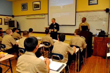 US Navy 101216-N-8273J-056 Chief of Naval Operations (CNO) Adm. Gary Roughead makes a surprise stop in a classroom to talk with students while visi